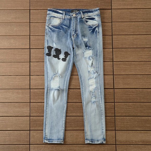 AMIRI Embroidered Logo Ripped Jeans